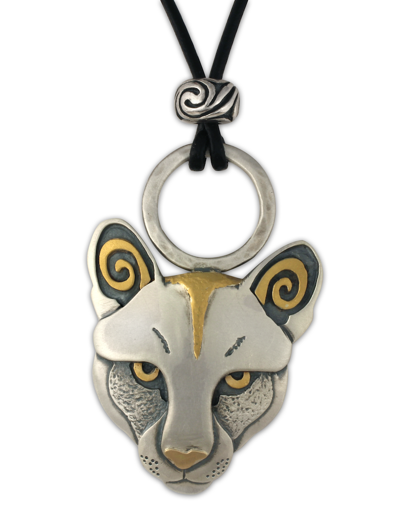 Our Mountain Lion pendant, created by Helen Chantler, features 24K fair trade gold accents.